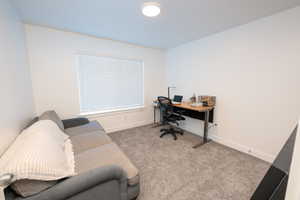Office space with carpet floors and baseboards