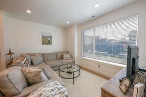 Living area featuring recessed lighting and wood finished floors