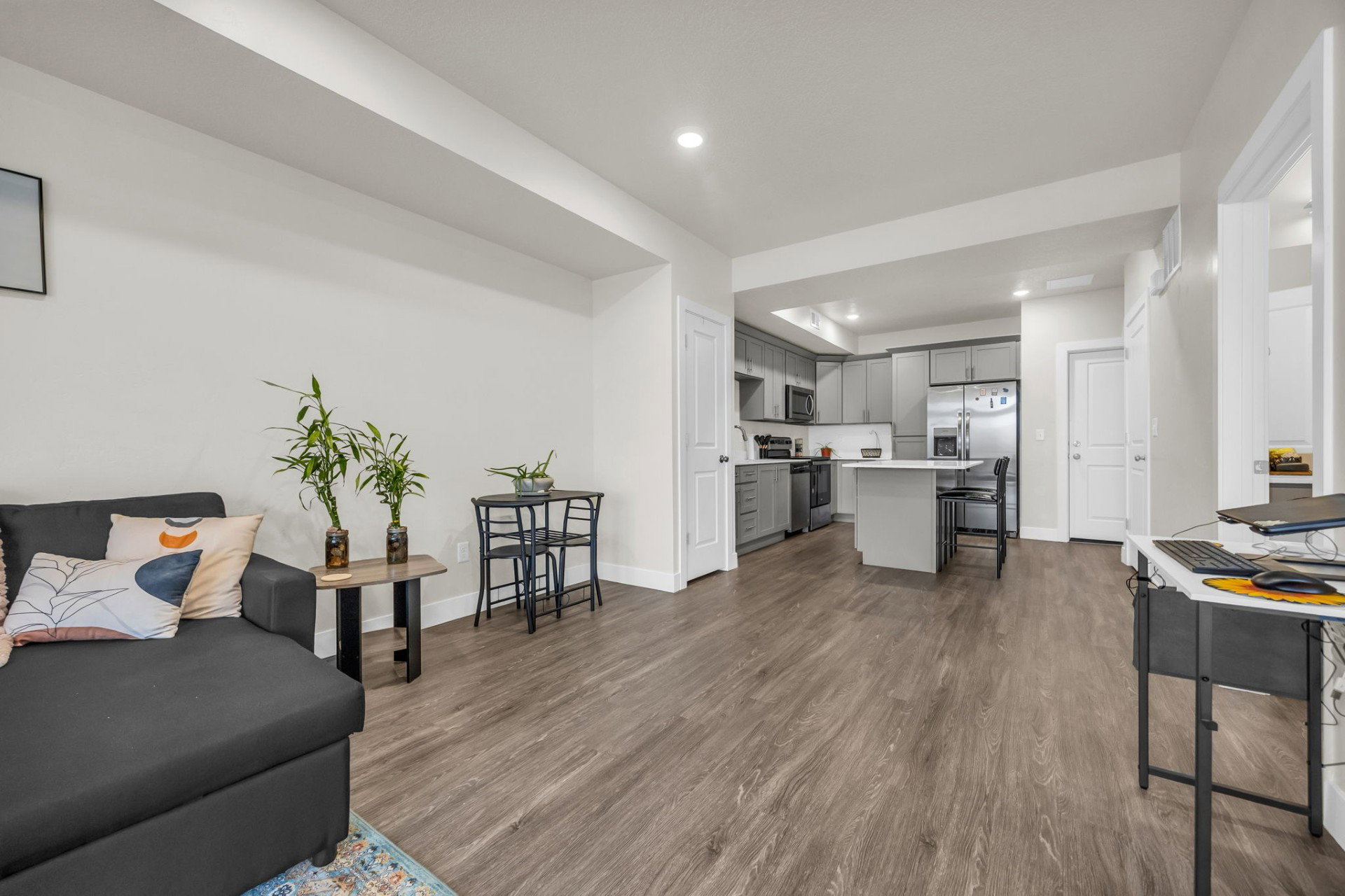 Living area with recessed lighting and dark wood finished floors