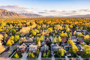 Aerial perspective of suburban area featuring a mountainous background