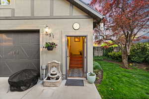 Property entrance featuring stucco siding
