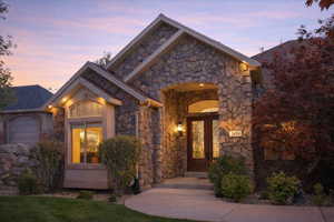 View of front of property featuring stone siding