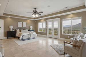 Bedroom with french doors, ornamental molding, access to outside, ceiling fan, and a mountain view