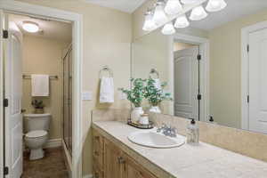 Full bathroom featuring vanity and a stall shower