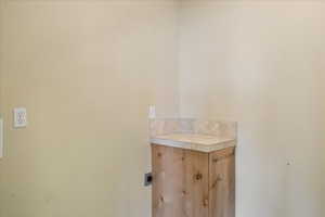 Laundry room featuring hookup for an electric dryer