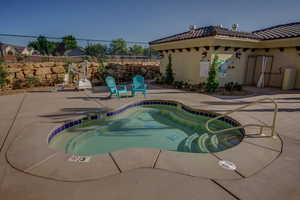 View of swimming pool with a pool and patio surround
