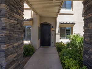 View of exterior entry featuring stucco siding