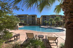 Community pool featuring a patio