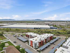 Bird's eye view of a mountain backdrop and industrial structures