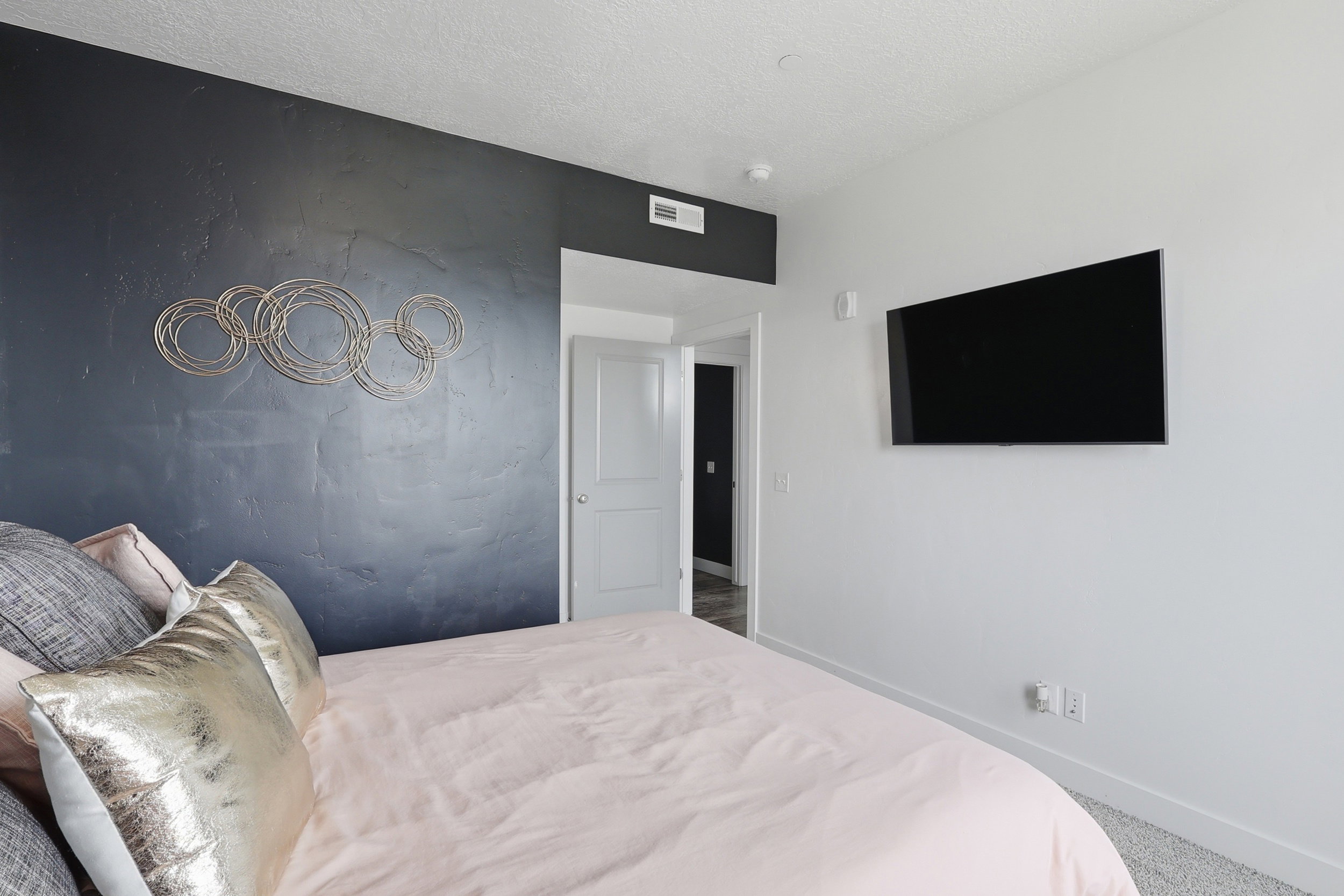 Carpeted bedroom featuring baseboards