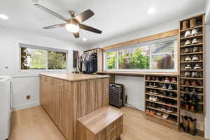 Walk in closet featuring light wood-style flooring