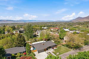 Aerial view of residential area featuring a mountainous background