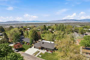 Aerial perspective of suburban area with a mountain backdrop