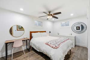 Bedroom featuring wood finished floors, ceiling fan, and recessed lighting