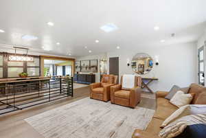Living area featuring recessed lighting and light wood-style flooring