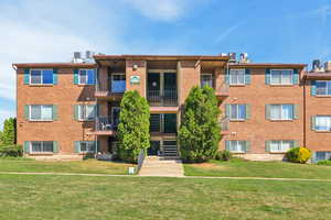 View of apartment building / complex featuring stairway