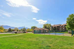 View of yard with a mountain view and a community pool