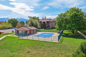 Community pool with a patio area and a mountain view