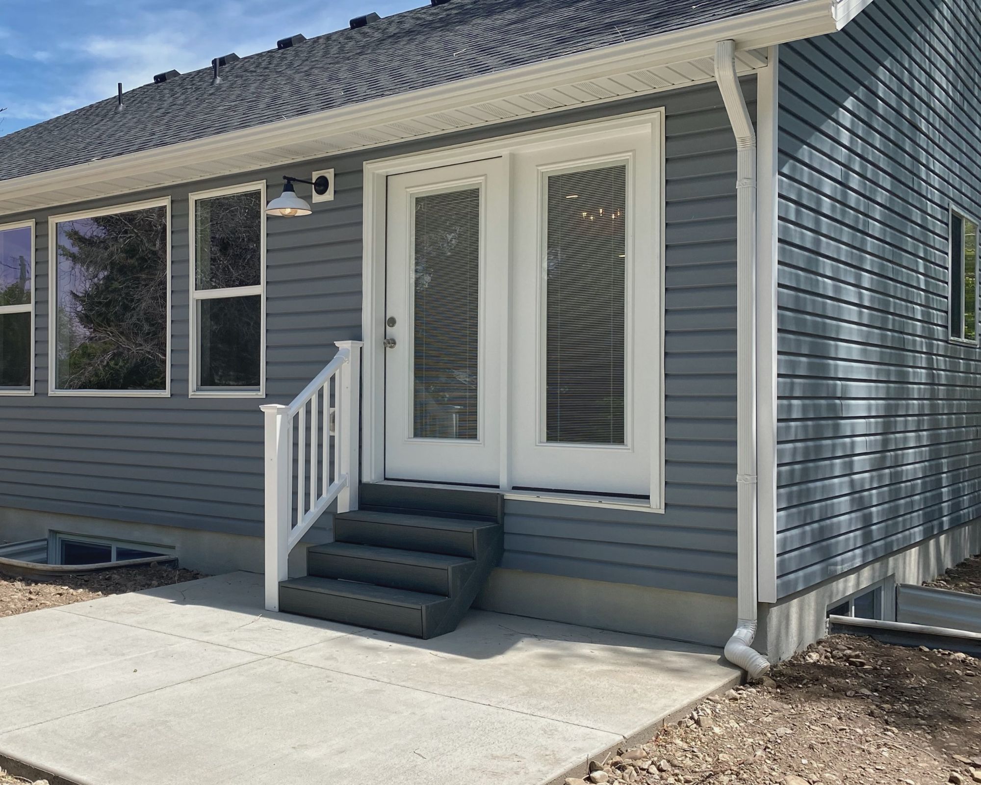 Entrance to property with a shingled roof