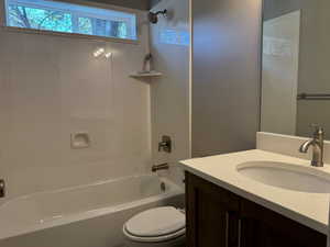 Bathroom featuring vanity and shower / washtub combination