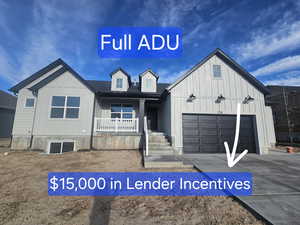 View of front of property featuring covered porch, board and batten siding, driveway, and a garage