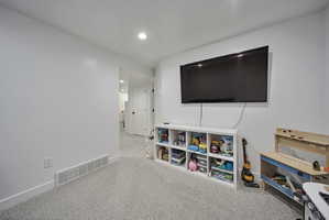 Playroom with carpet flooring and recessed lighting