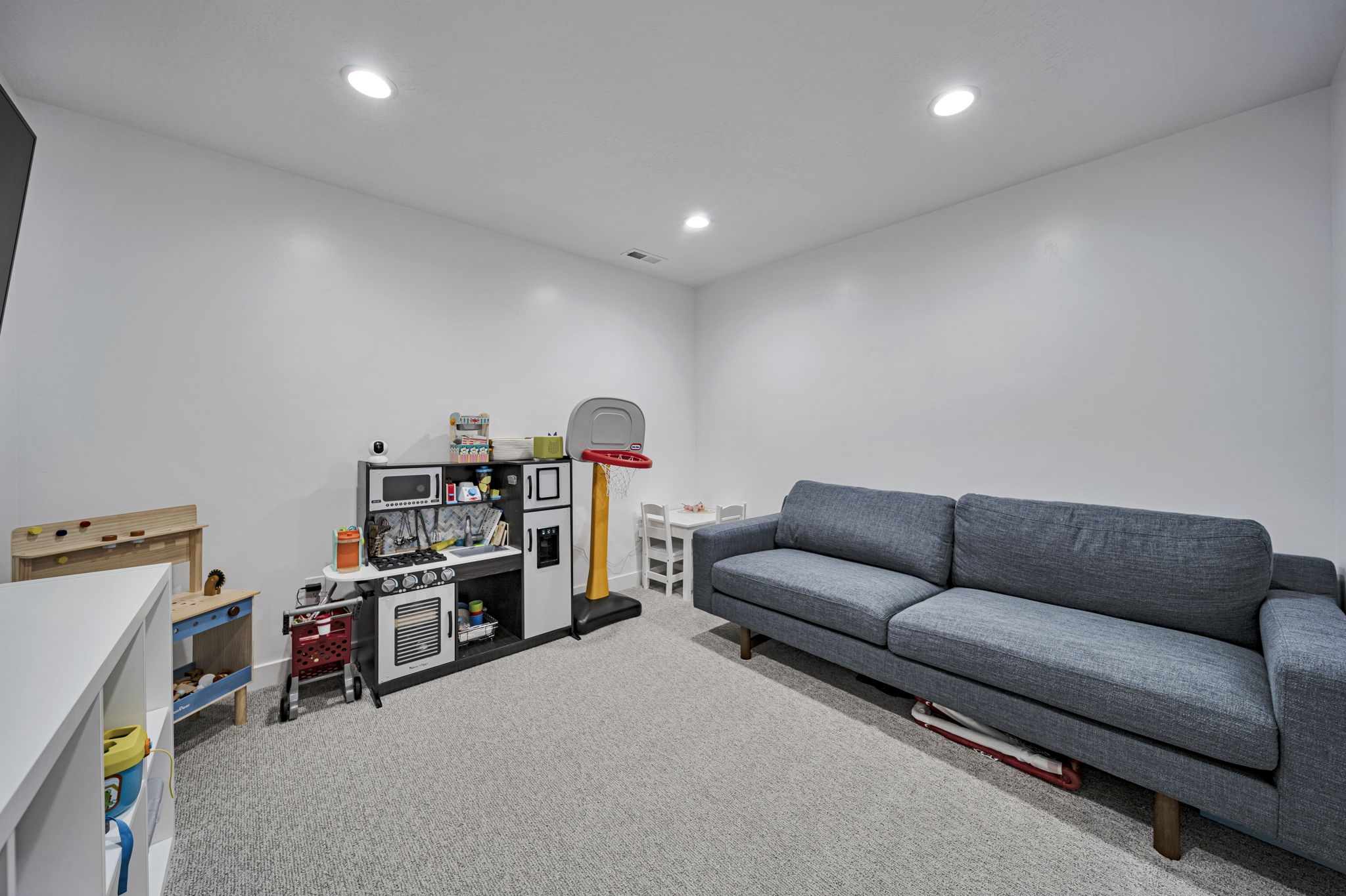 Game room with carpet and recessed lighting