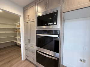 Kitchen with stainless steel appliances and light wood-type flooring