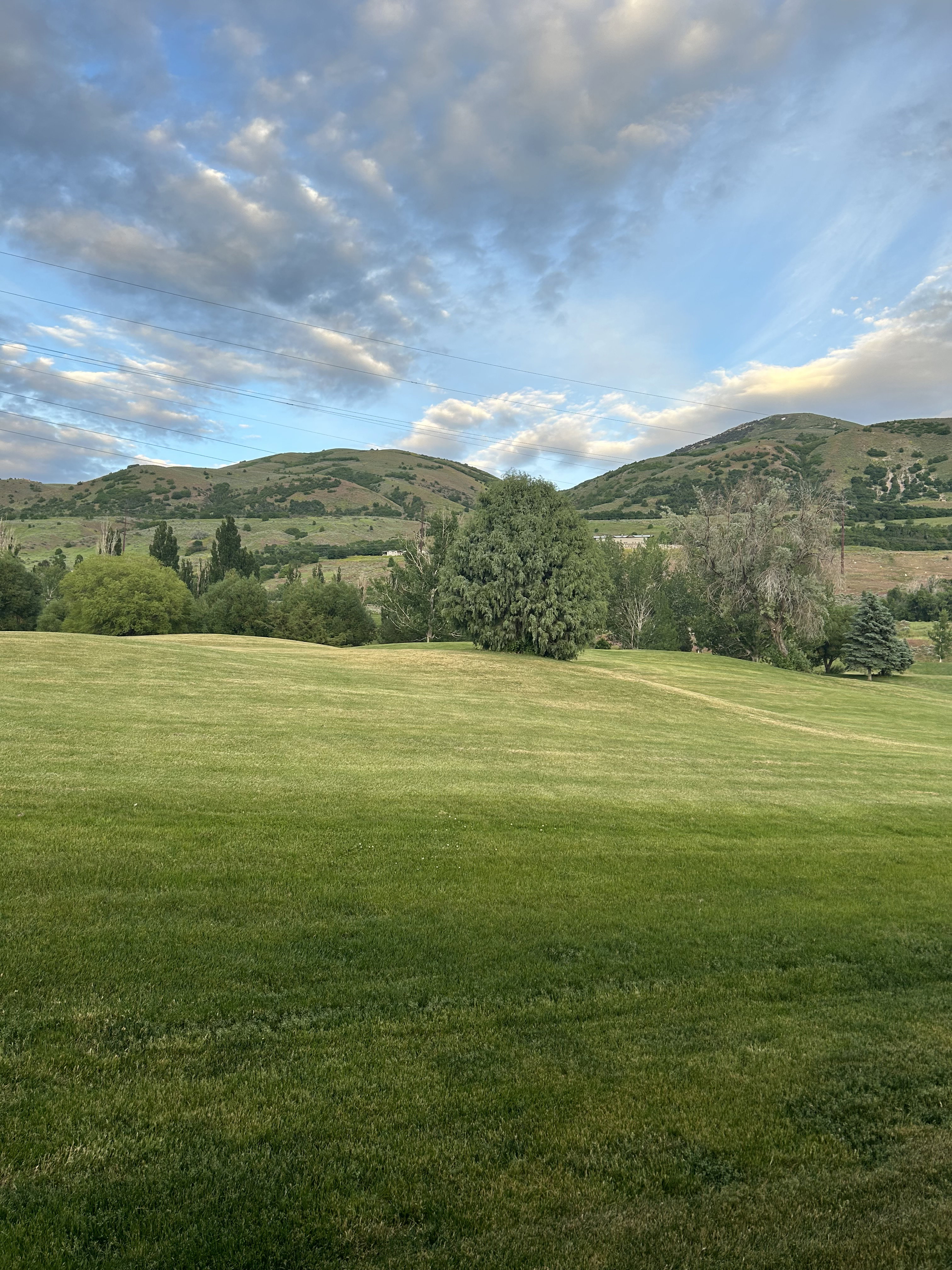 View of mountain background featuring rural landscape