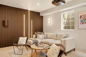 LOWER LEVEL MOVIE ROOM ADJACENT TO HOME GYM AND SMALL SAFE ROOM