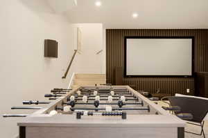 MOVIE ROOM WITH GAMING TABLE ADJACENT HOME GYM