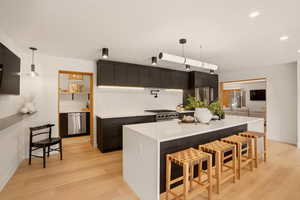 KITCHEN WITH ACCESS TO BUTLER'S KITCHEN / PANTRY - OPENS TO OUTDOOR GRILLING AREA