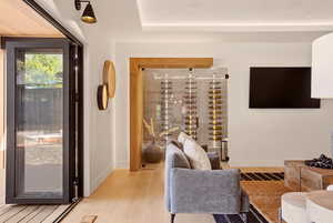 FAMILY ROOM WITH WINE ROOM AND EXPANSIVE FOLDING PATIO DOOR