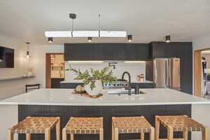 BAR AREA AND KITCHEN WITH BUTLER PANTRY