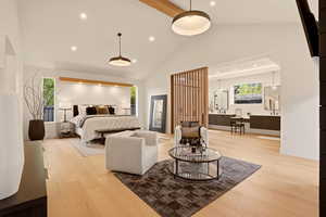 MAIN FLOOR PRIMARY BEDROOM SUITE WITH ANGLED PRIVACY WALNUT WALL