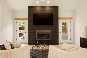 MAIN FLOOR PRIMARY BEDROOM SUITE WITH GAS FIREPLACE AND OPENS ONTO BACK YARD