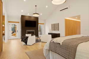 MAIN FLOOR PRIMARY BEDROOM SUITE WITH GAS FIREPLACE AND OPENS ONTO BACK YARD