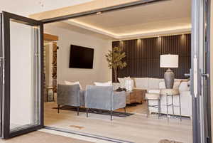 FAMILY ROOM WITH WINE ROOM AND EXPANSIVE FOLDING PATIO DOOR