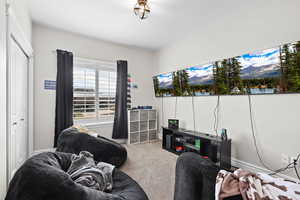 Living area featuring carpet flooring