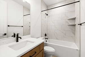 Full bath with vanity and tub / shower combination