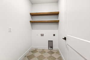 Laundry area with electric dryer hookup, light flooring, and washer hookup
