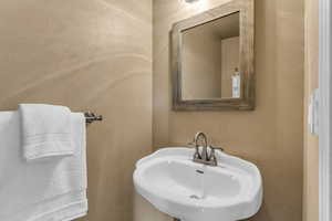 Bathroom featuring a textured wall