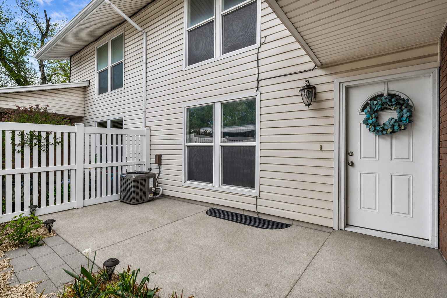 View of exterior entry featuring a patio area
