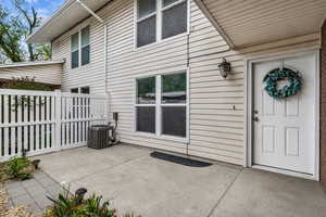 View of exterior entry featuring a patio area