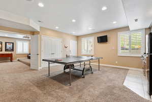Game room with light colored carpet, healthy amount of natural light, and recessed lighting