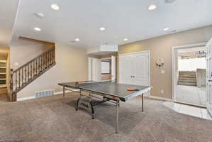 Playroom with light colored carpet and recessed lighting