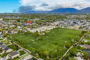 Aerial perspective of suburban area with a mountainous background