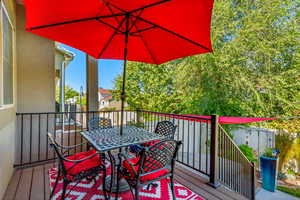 Wooden terrace featuring outdoor dining area