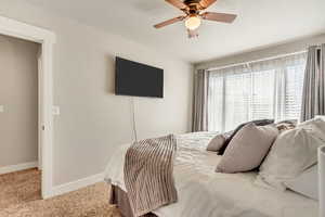 Bedroom with carpet flooring and a ceiling fan
