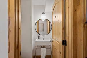 Half bathroom with a sink